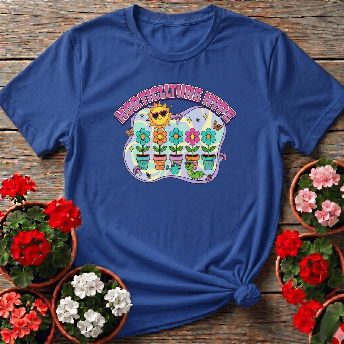 Royal bright funky gardening tee featuring illustrated blooms, a caterpillar, and a sun in heart shades