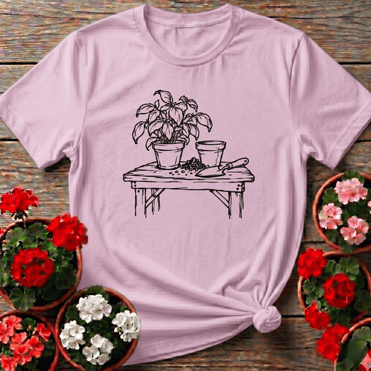 Light Pink minimalist cottagecore gardening tee with sketch potting bench basil and trowel for plant lovers