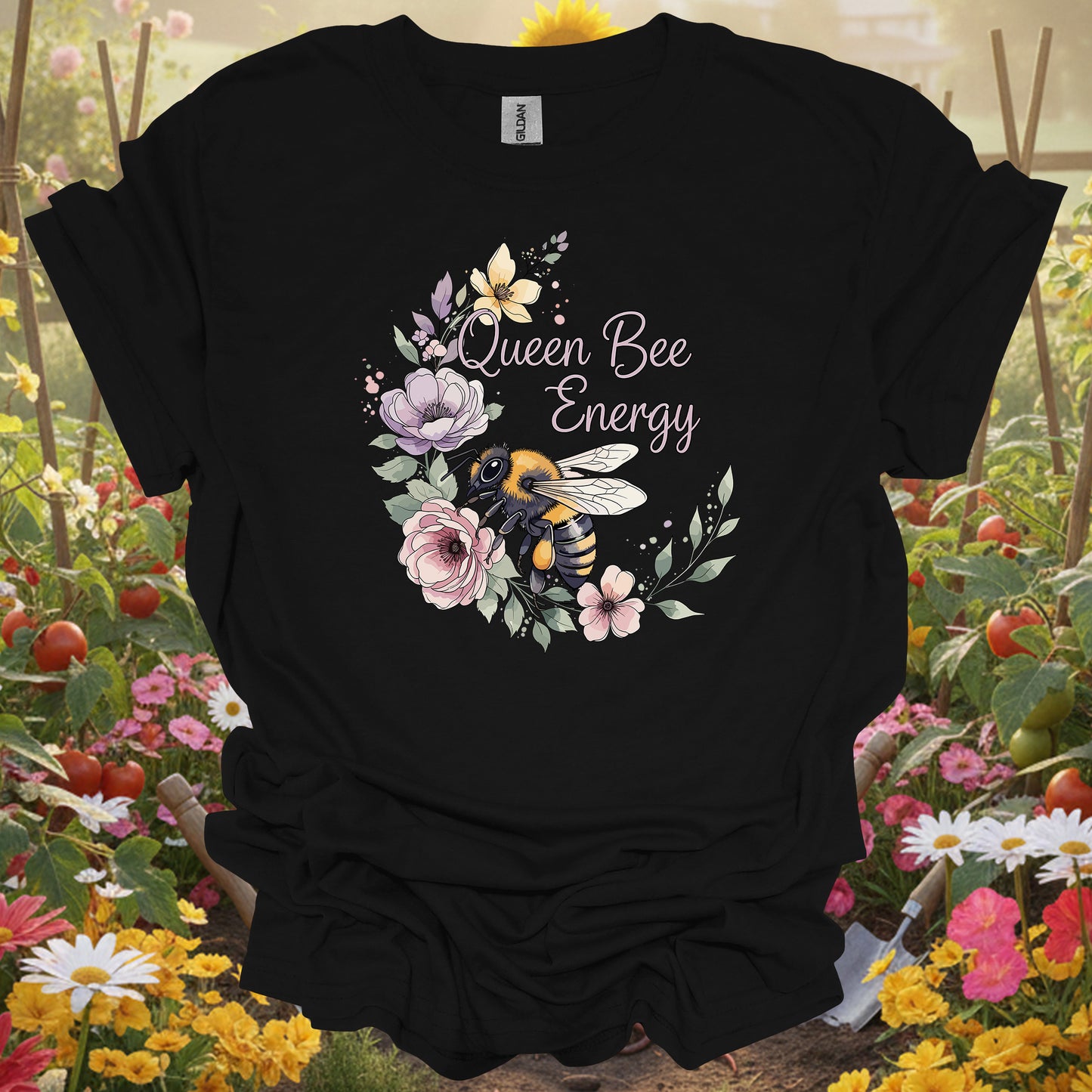 Black t-shirt with a vibrant queen bee energy theme that fits a modern slow-living garden aesthetic and lifestyle.