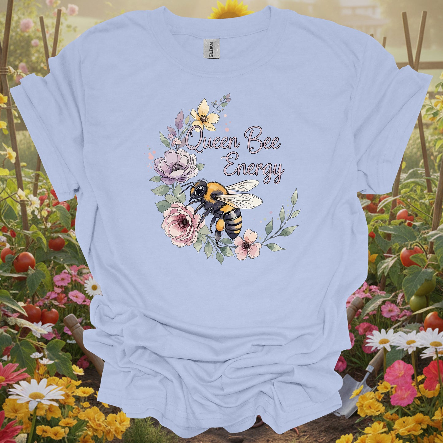 Light Blue shirt with a detailed honeybee and pastel blossom theme making a beautiful pollinator T-shirt for any gardener.