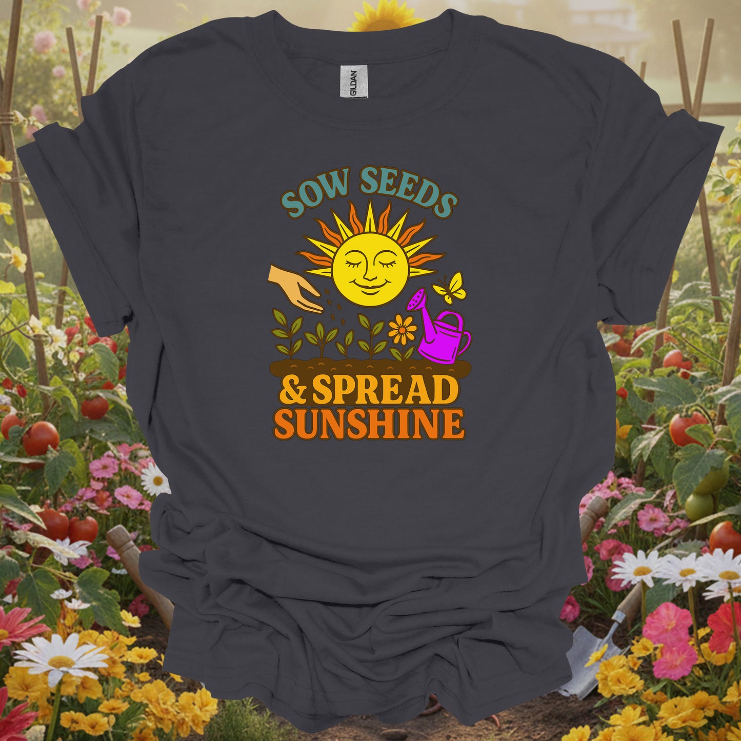 Charcoal tee featuring a smiling sun and seedling design that celebrates sowing seeds and spreading sunshine in the garden.