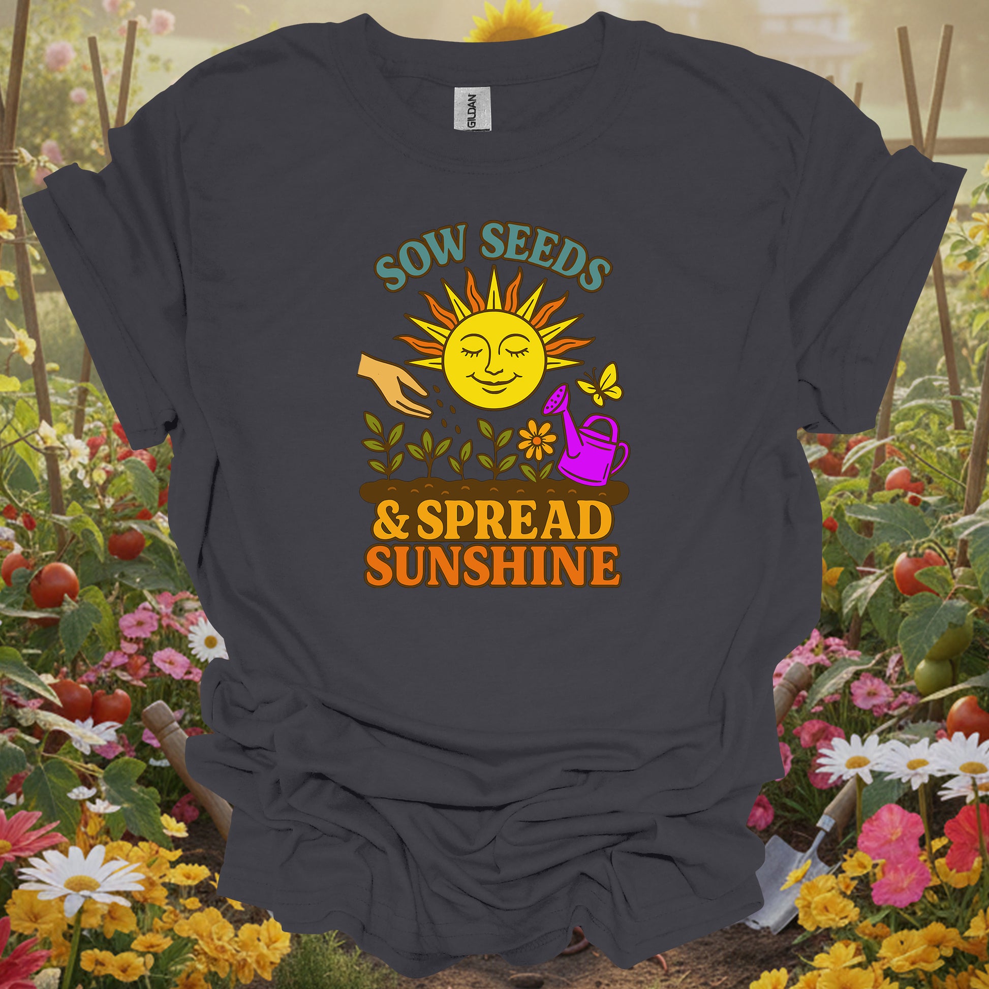 Charcoal tee featuring a smiling sun and seedling design that celebrates sowing seeds and spreading sunshine in the garden.