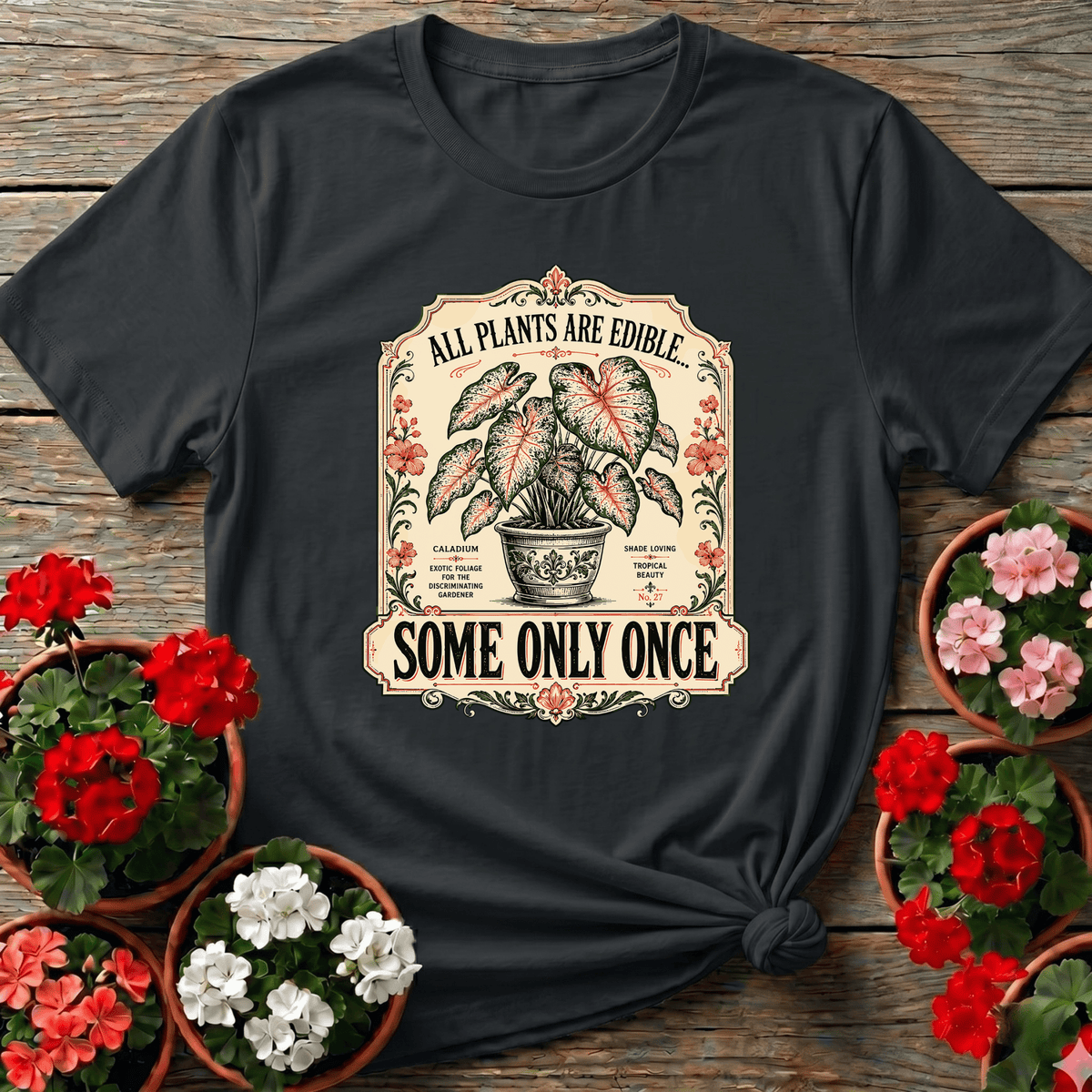 Black vintage botanical label gardening tee with "All Plants Are Edible Some Only Once" caladium design for plant lovers