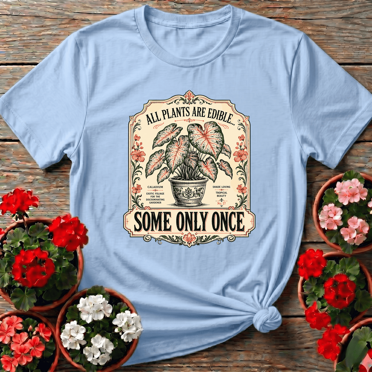 Light Blue cottage garden apothecary style tee with "All Plants Are Edible Some Only Once" for the curious plant collector