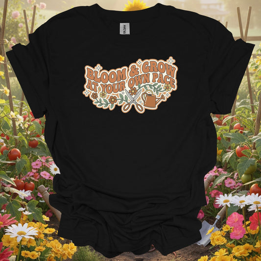 Black tshirt showing retro bloom and grow at your own pace gardening for vintage style fans