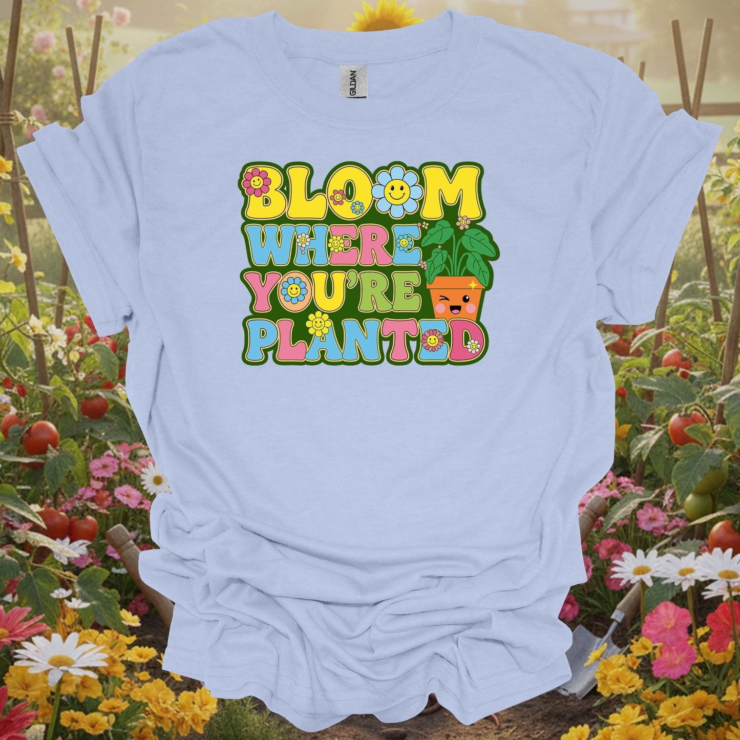 Light Blue shirt showing retro smiley face with bloom where planted floral design for people adapting to their space