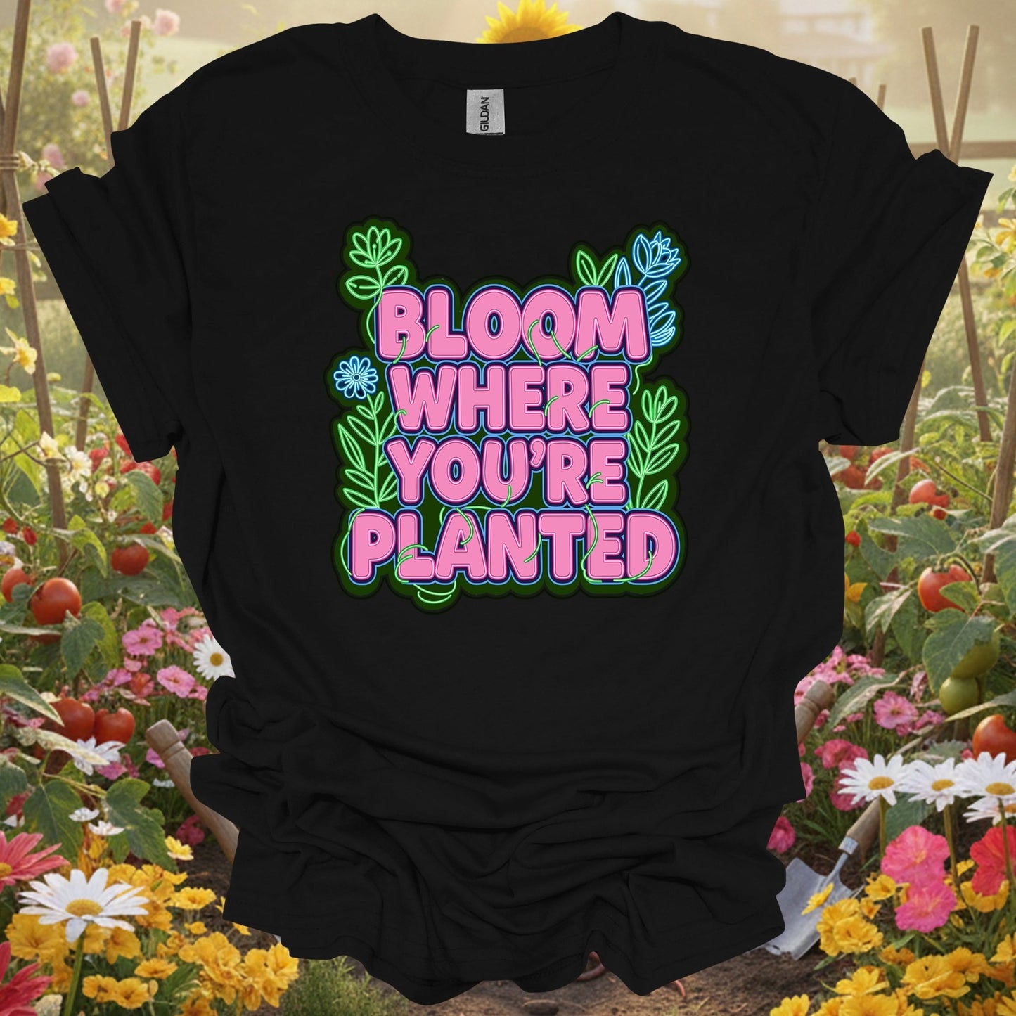 Black shirt showing bright bloom where you're planted text with plants for gardeners who need the reminder