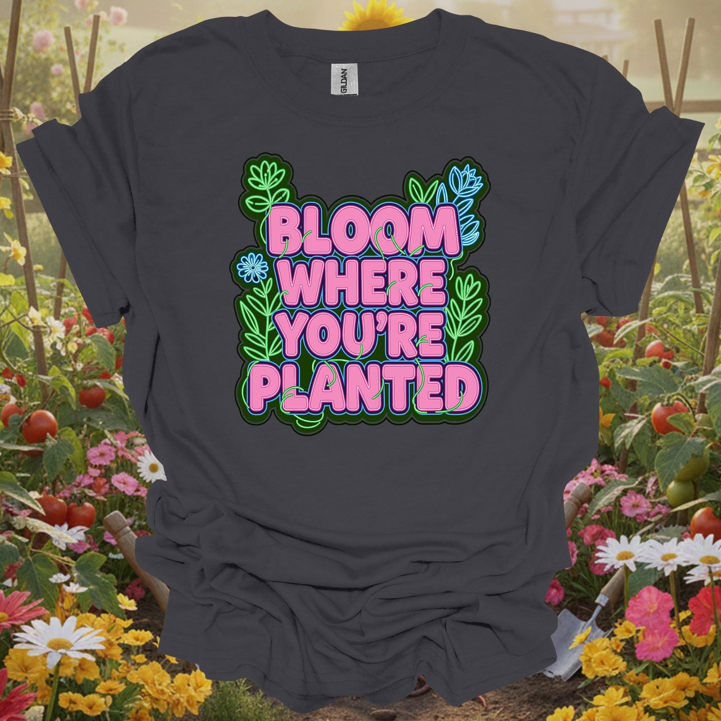 Charcoal tee showing bright bloom where you're planted text with plants for gardeners who need the reminder