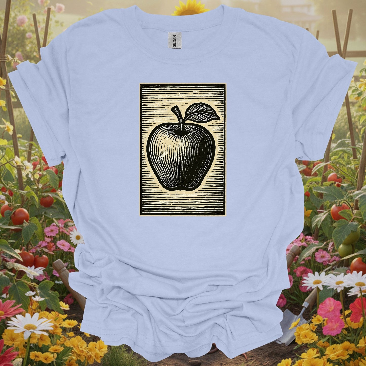 LIght blue shirt showing classic linocut apple illustration garden for home gardeners