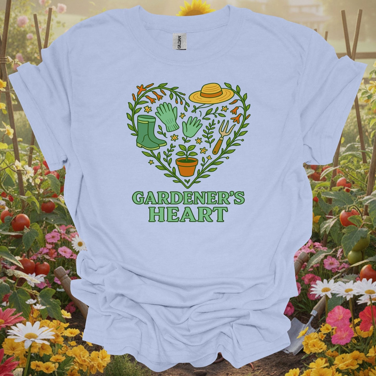 LIght blue tshirt showing a classic pair of boots and essential tools arranged in a symbol of affection for the earth for beautifiers creating floral displays