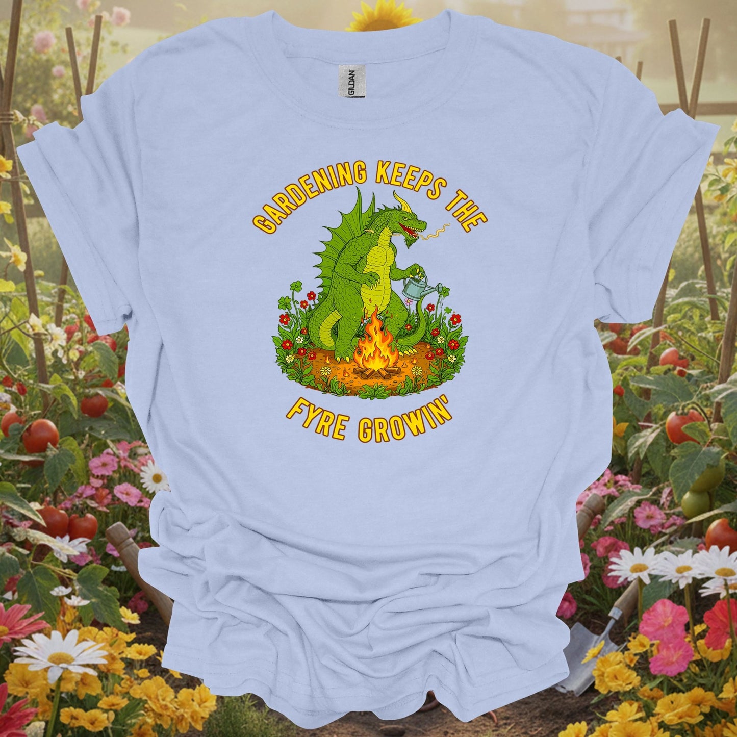 LIght blue tshirt showing a legendary dragon guarding a vibrant garden, symbolizing the strength and protection required for a thriving landscape for food security advocates ensuring local resilience
