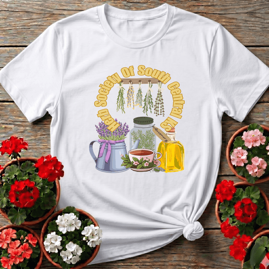 White vintage botanical herbalist tee with lavender watering can tea cup and herb drying rack illustration