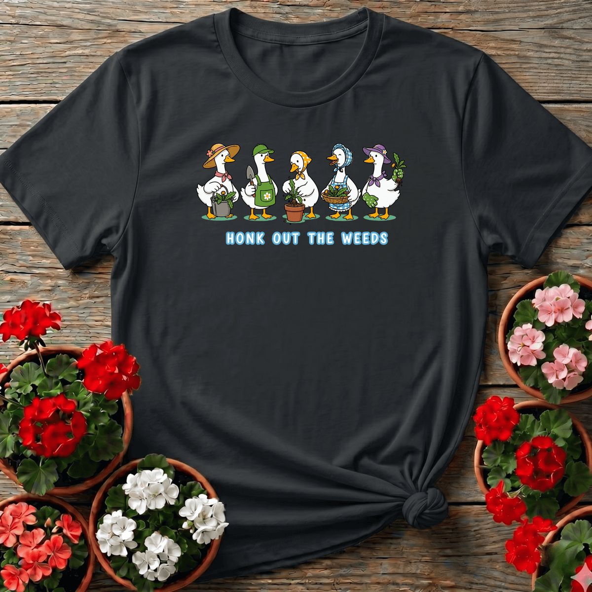 Black kawaii cottagecore gardening tee "Honk Out the Weeds" with goose squad illustration for garden humor lovers