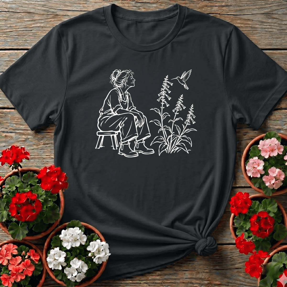Black minimalist line art gardening tee with woman watching hummingbird near foxglove blooms for garden lovers