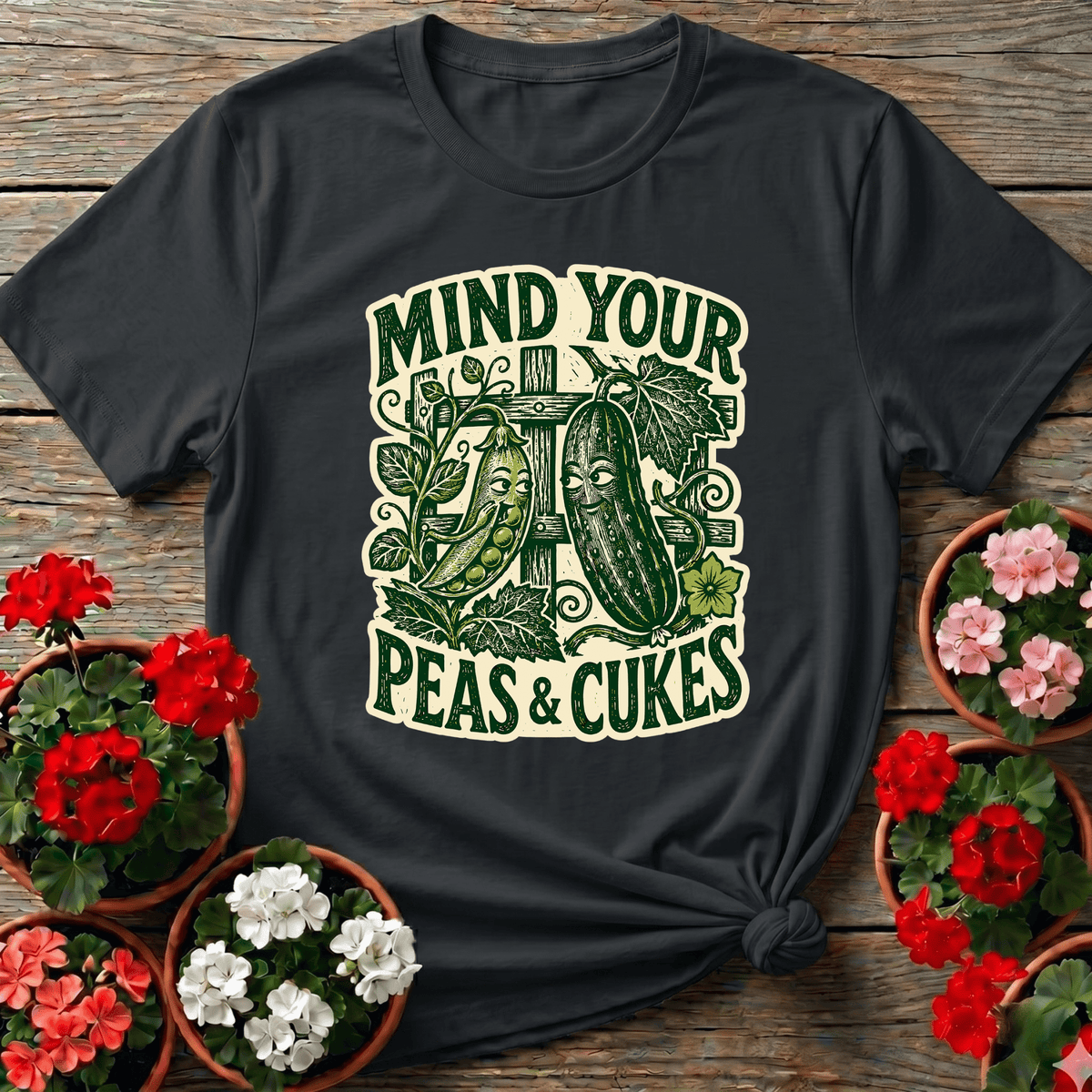 Black vintage woodcut vegetable gardening tee with "Mind Your Peas and Cukes" for humor-loving gardeners
