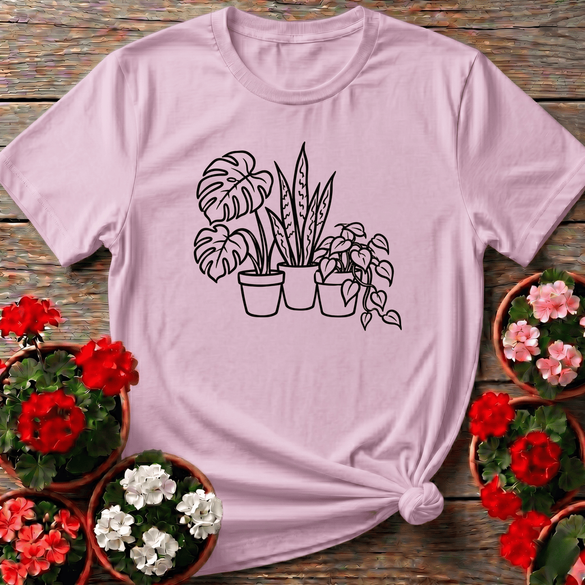 Light Pink soft botanical line art plant parent tee with monstera snake plant and pothos trio design