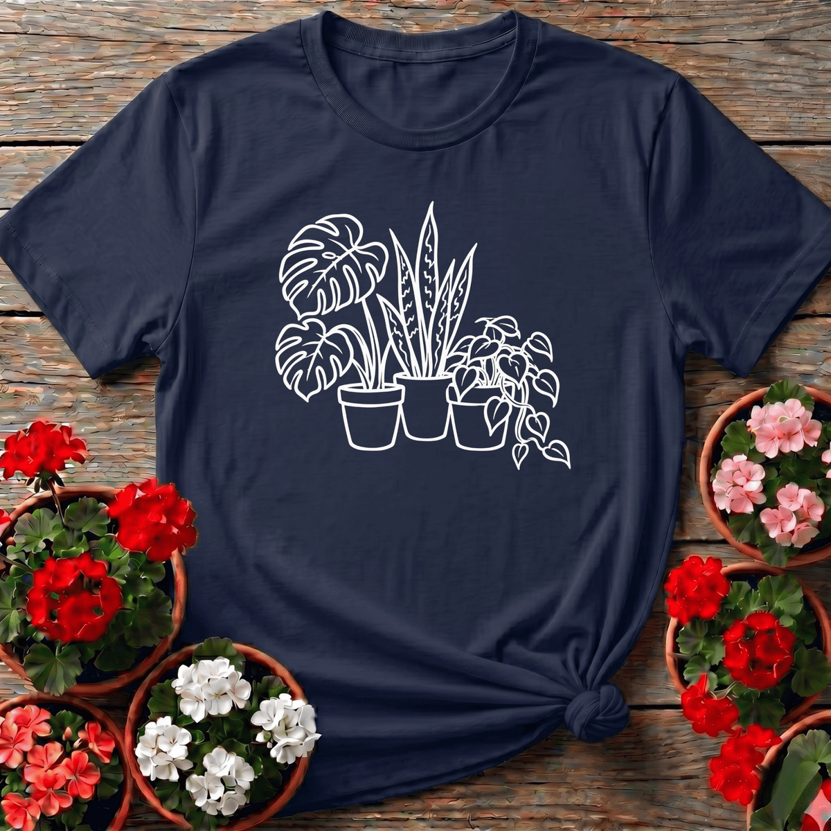 Navy minimalist botanical line art gardening tee featuring potted monstera snake plant and trailing pothos