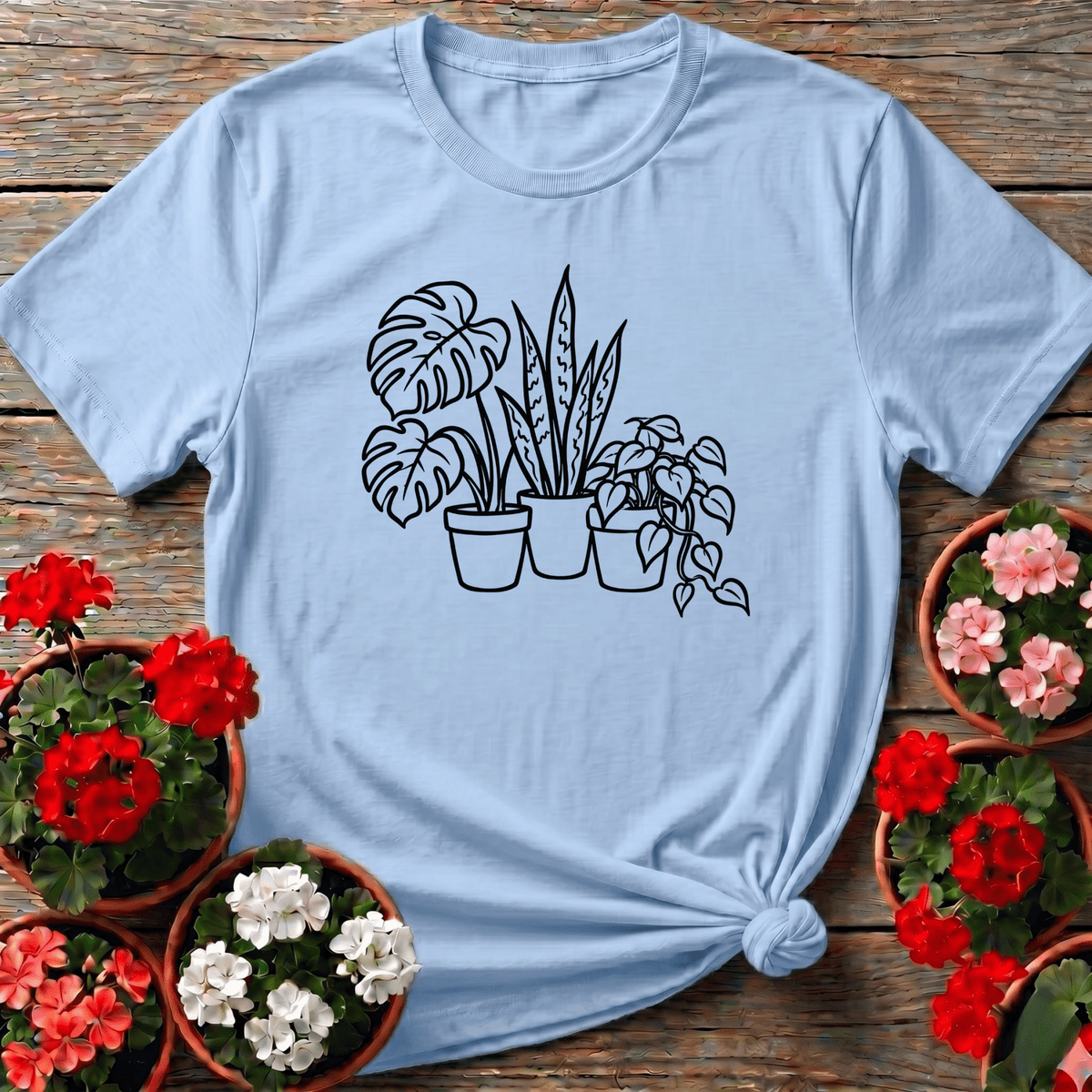 Light Blue clean botanical illustration plant parent t-shirt with potted monstera snake plant and pothos