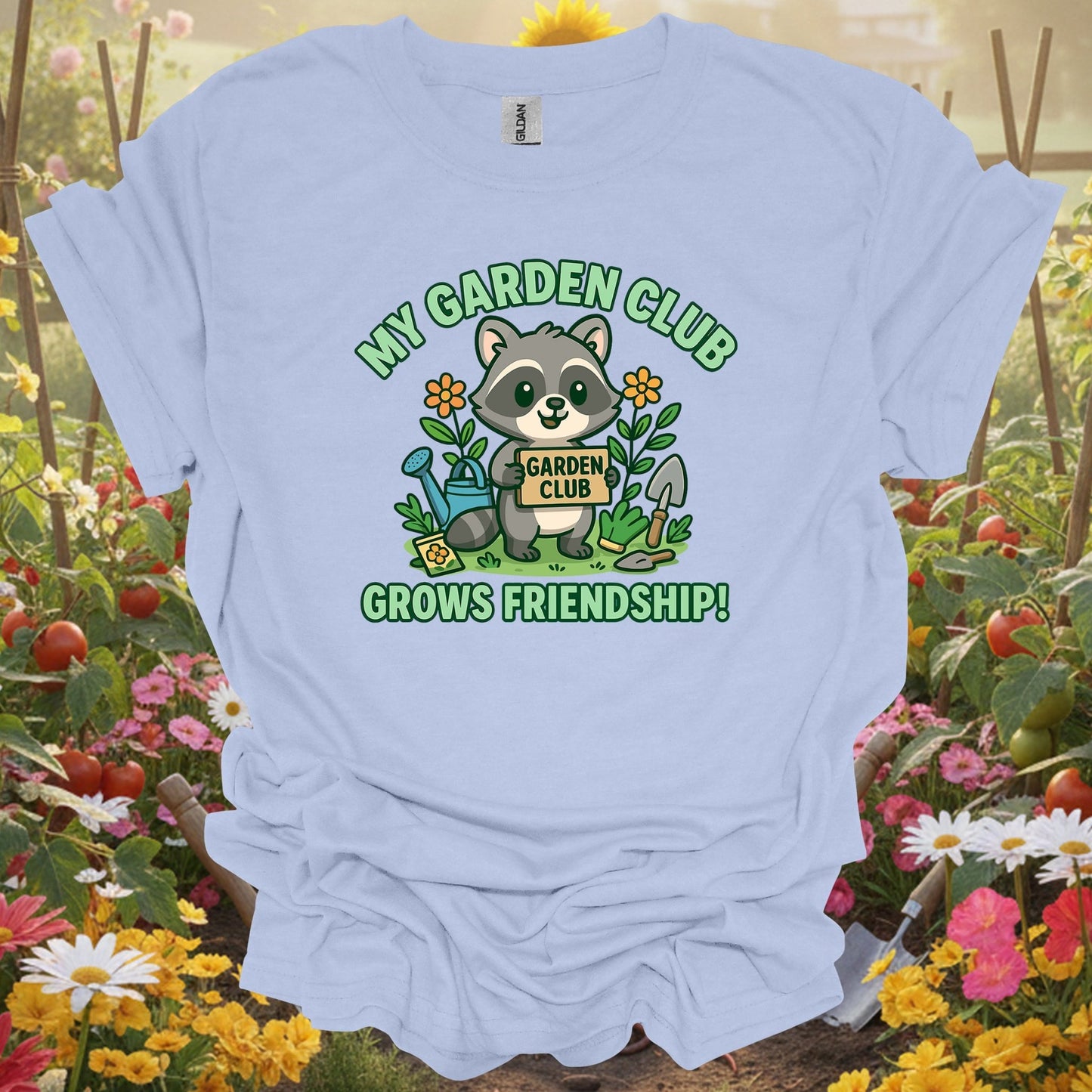 Light Blue shirt showing my garden club grows friendship raccoon for home gardeners