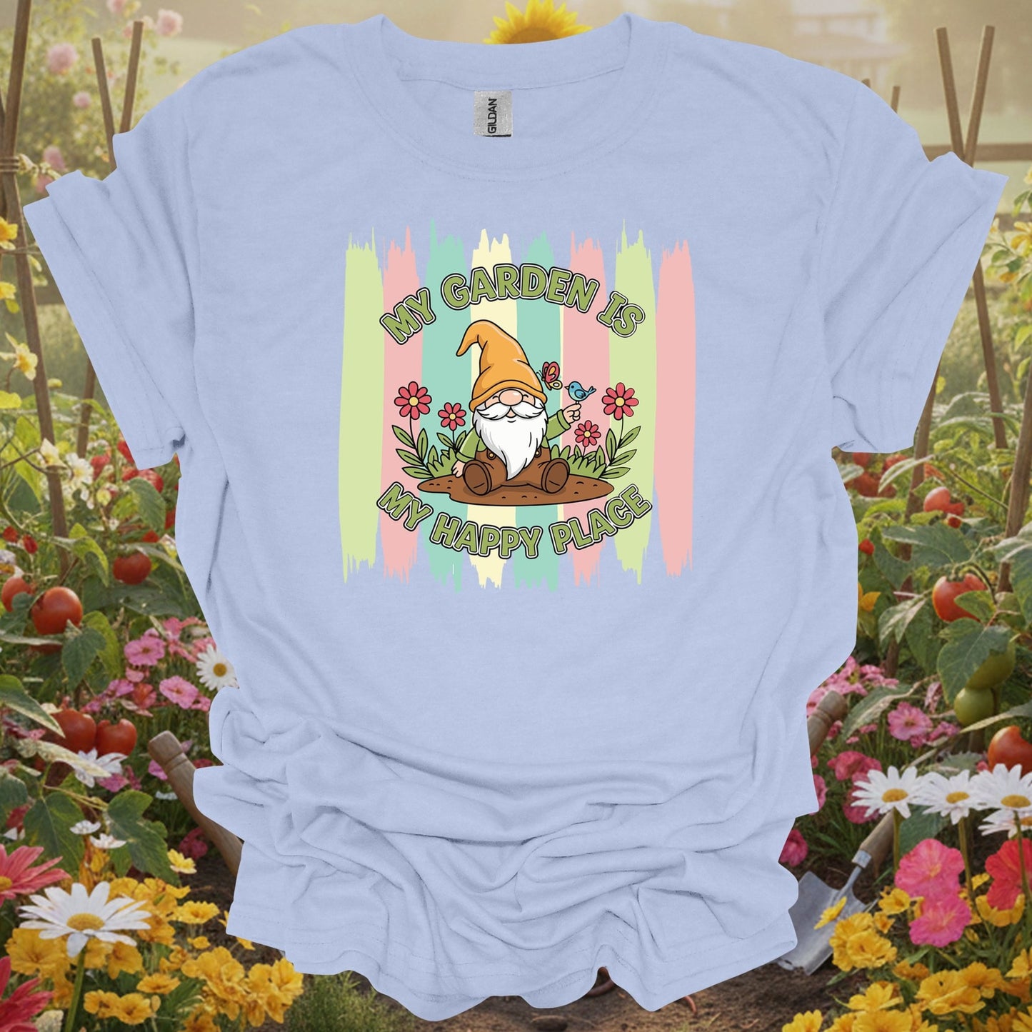 LIght blue tshirt showing a friendly garden gnome who represents the patient and joyful spirit of a well-tended yard for donors providing resources