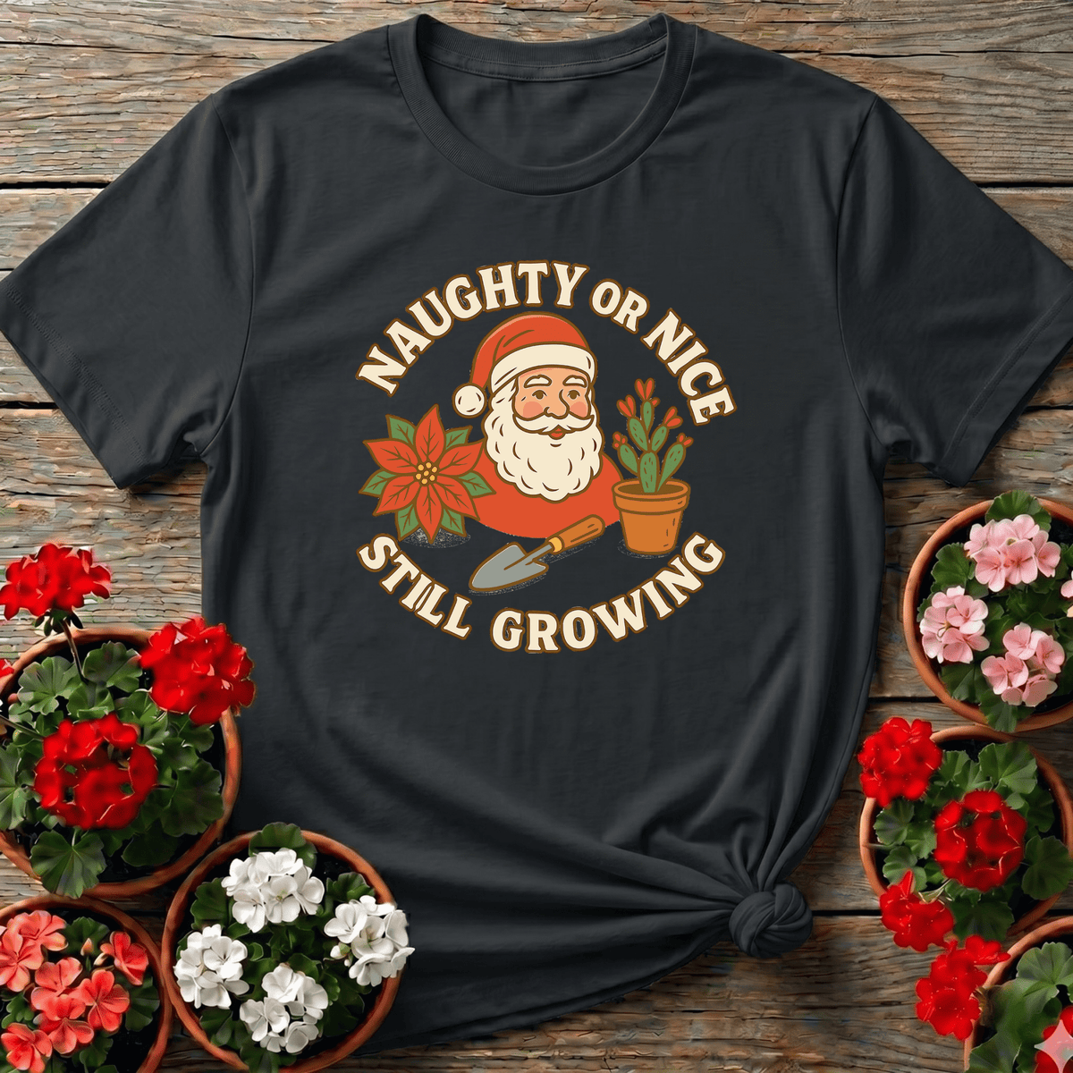 Black retro badge Christmas gardening tee with "Naughty or Nice Still Growing" for plant lovers