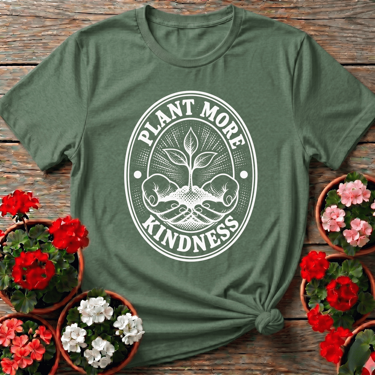 Military Green retro seed packet style gardening tee with "Plant More Kindness" oval graphic for outdoor lovers