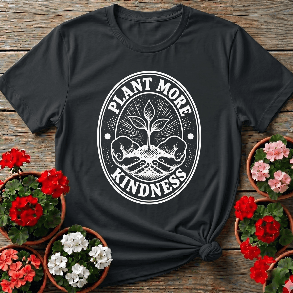 Black vintage badge gardening tee with "Plant More Kindness" cupped seedling design for plant lovers