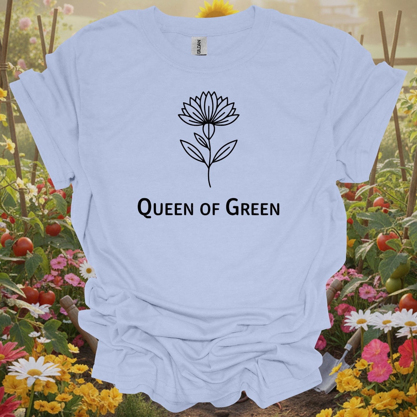 LIght blue tee showing elegant botanical lotus flower queen of green design for botanical queens