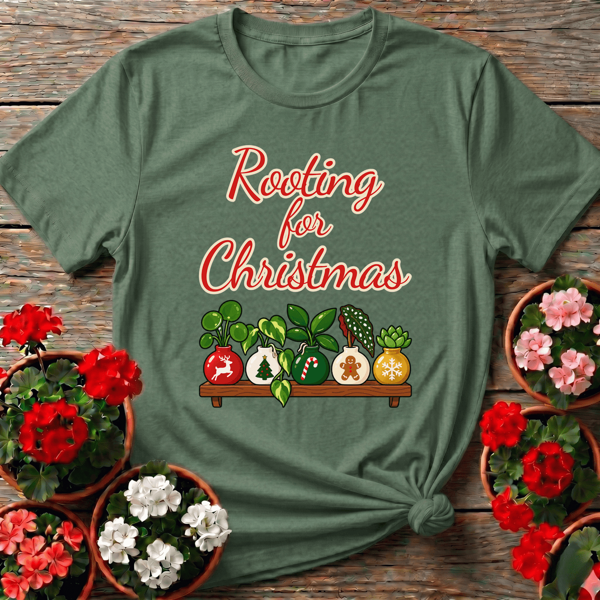 Military Green festive plant lover shirt "Rooting for Christmas" with illustrated holiday shelf and seasonal houseplants