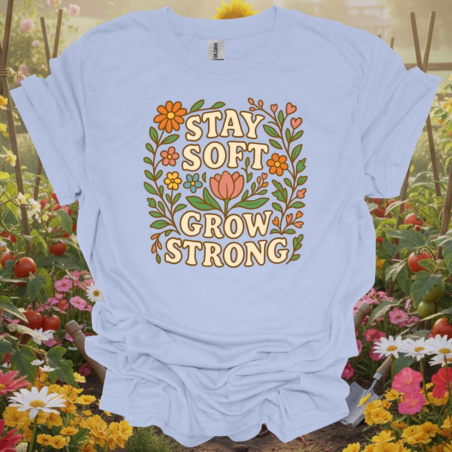 LIght blue shirt showing stay soft grow strong botanical floral for people who love blooms