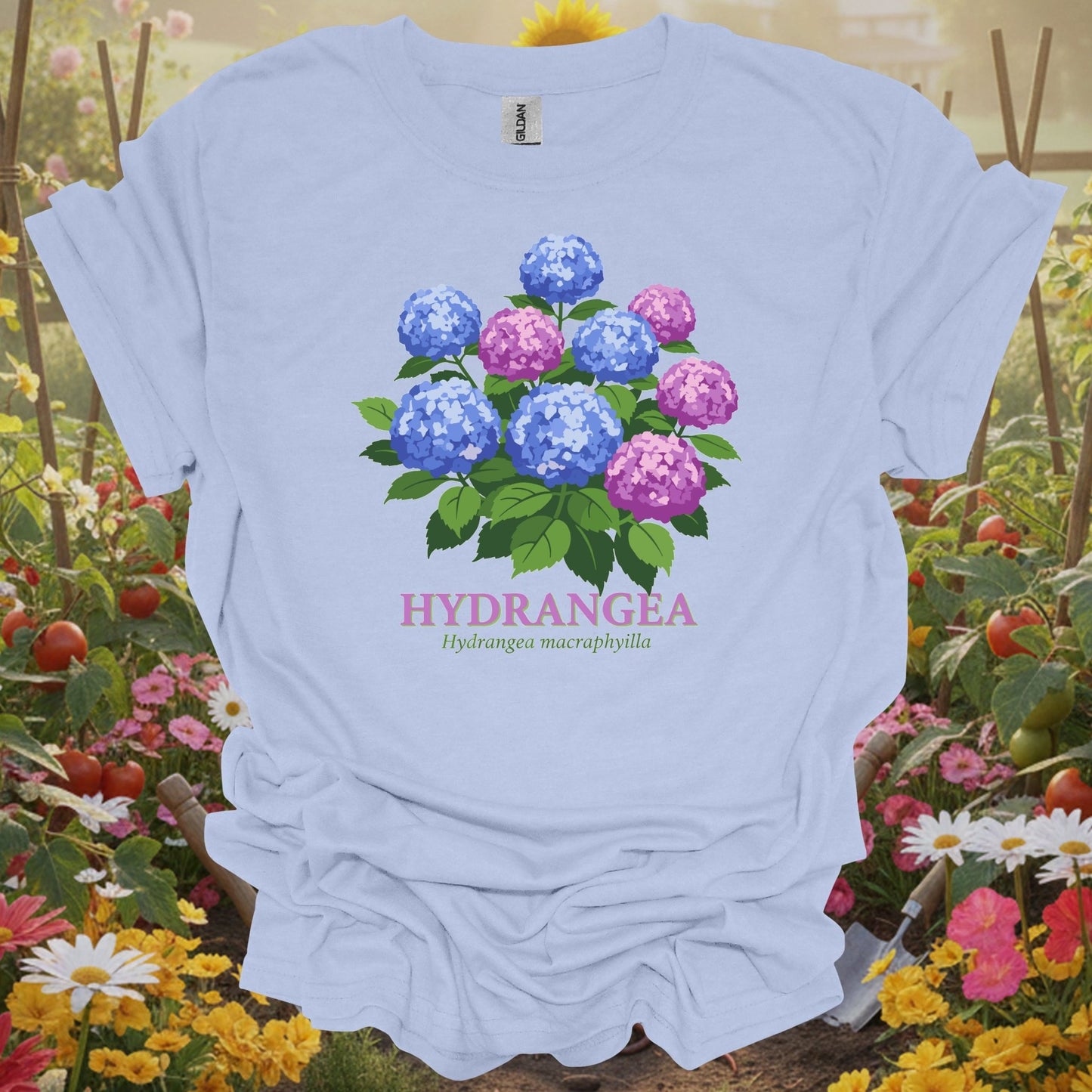 Light Blue tee with a vibrant storybook illustration of blooming hydrangeas and scientific names for mindful gardeners