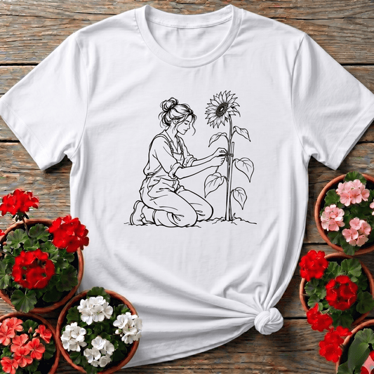 White fine line botanical illustration gardening shirt with kneeling woman and sunflower for gardeners
